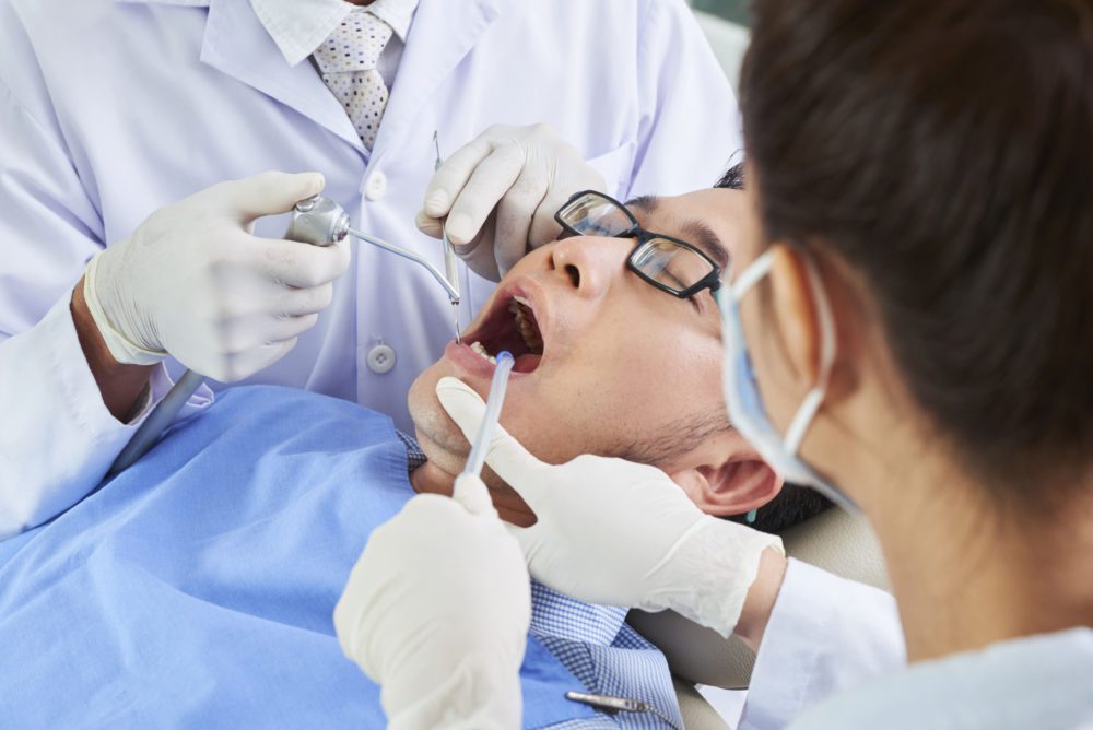 asian-man-having-dental-surgery-B578XAC